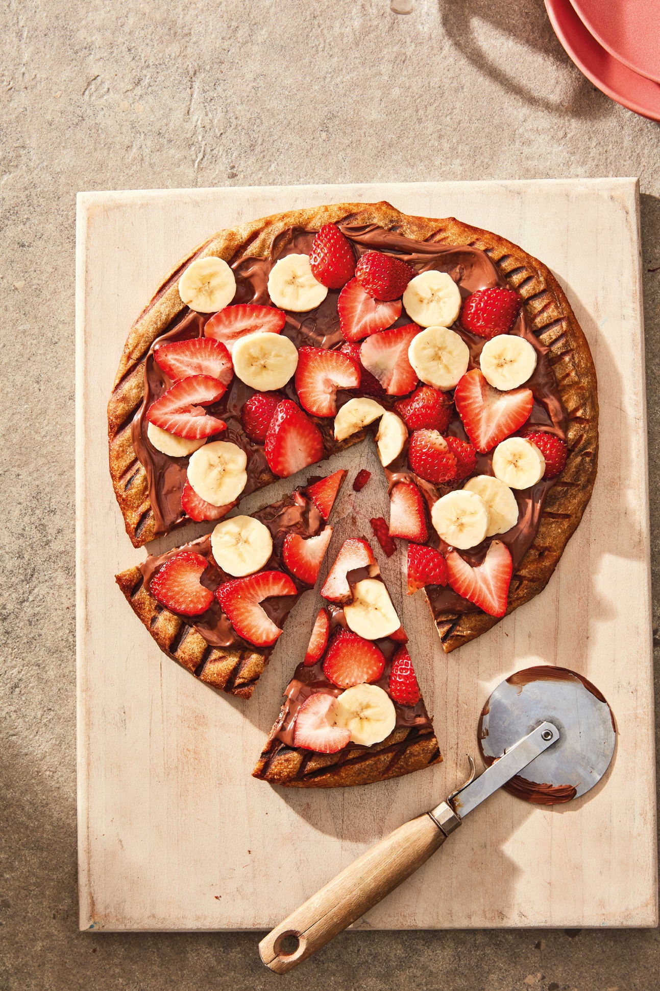 Foto van Pizza met hazelnootpasta, banaan en aardbeien door WW